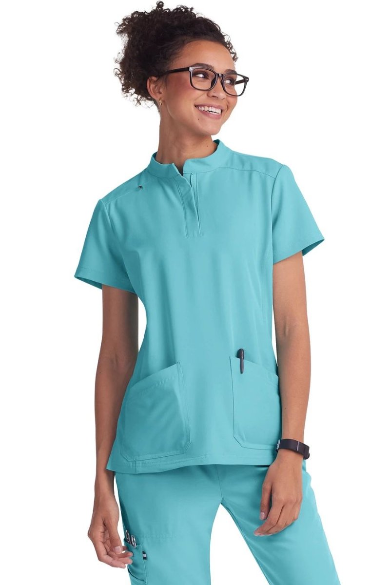 koi Next Gen Driven Women's 4-Pocket Mandarin Collar Scrub Top in sea glass at Parker's Clothing and Scrubs.