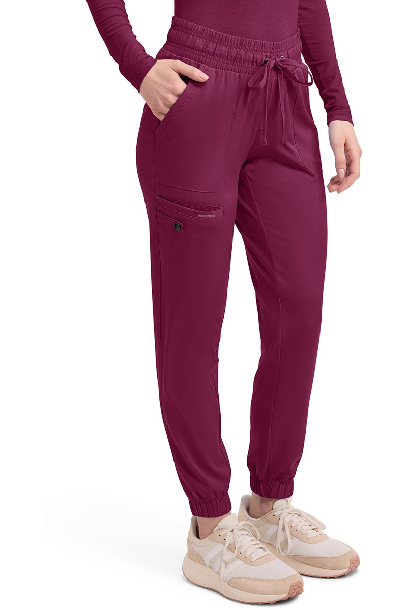 Women's Healing Hands HH Works Renee 9575 jogger scrub pants in wine with moisture-wicking technology