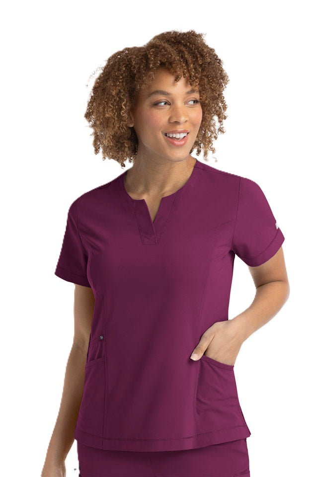 Wine burgundy scrub top featuring princess seams, side vents, and zipper pocket - IRG EPIC 4802 nursing scrubs.