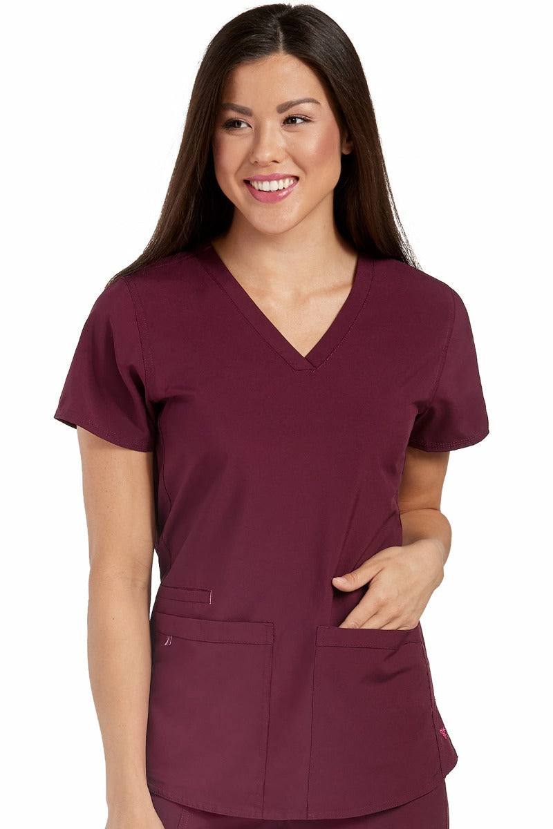 Med Couture Scrub Top Energy Serena Shirttail Hem V-neck in Wine at Parker's Clothing & Scrubs.