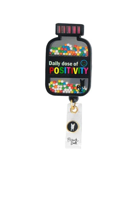 koi French Bull Daily Dose Of Positivity Shaker Retractable Badge Reel at Parker's Clothing and Shoes.