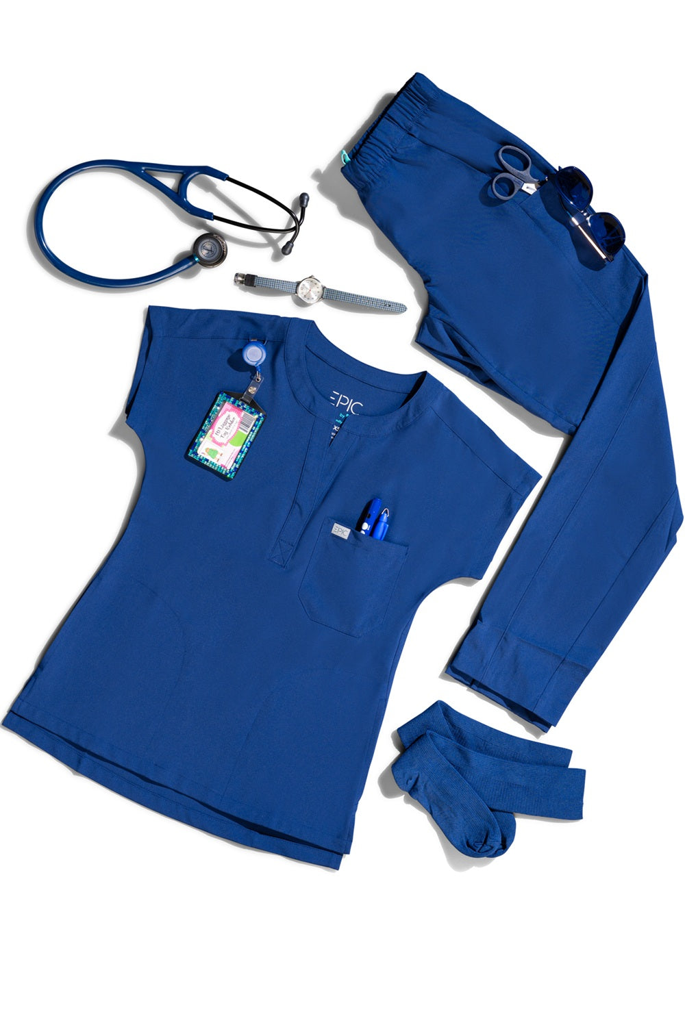 IRG Epic scrub set in navy blue featuring 360-degree stretch fabric - flat lay of medical scrub top and pants.