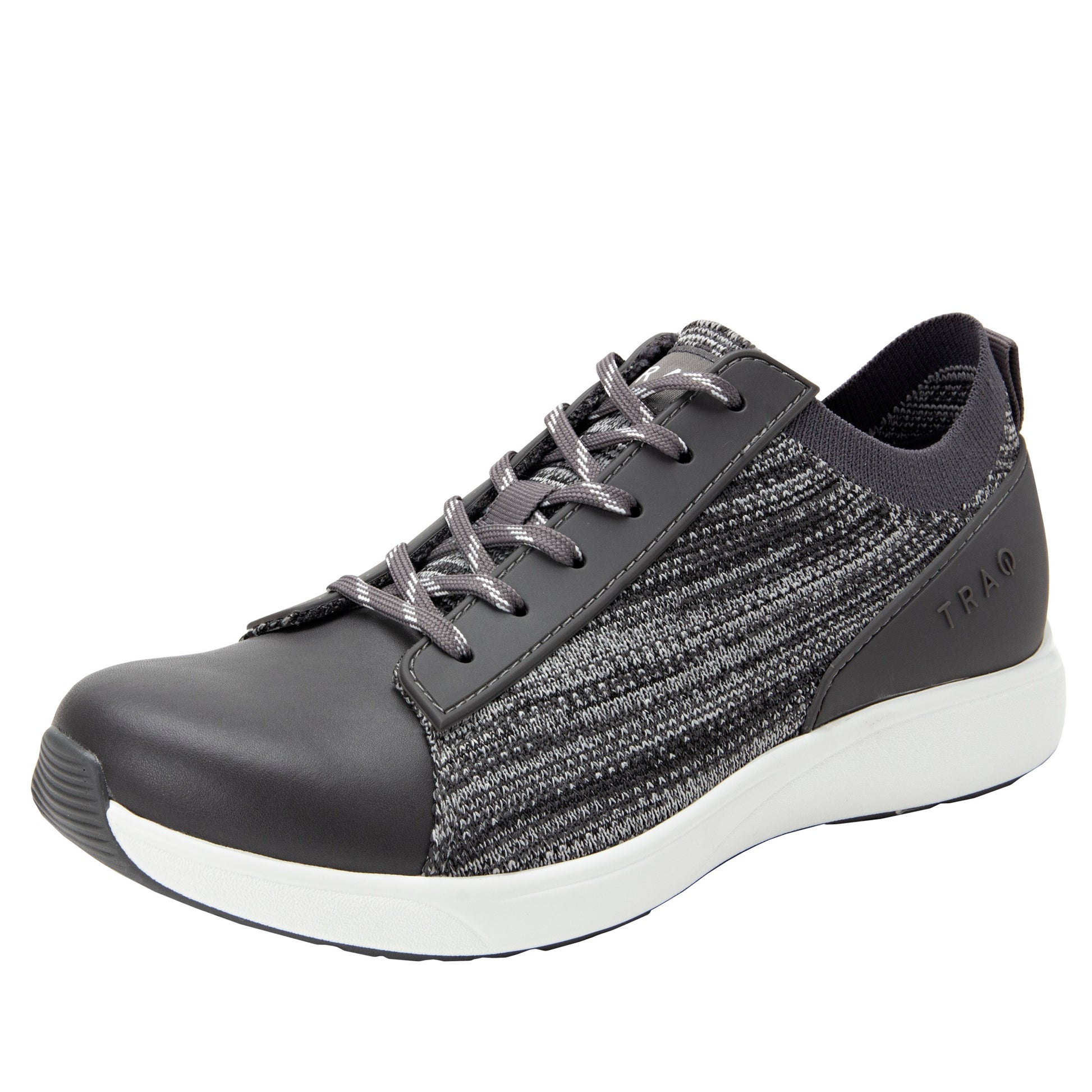 Gray athletic shoe with white sole on a white background