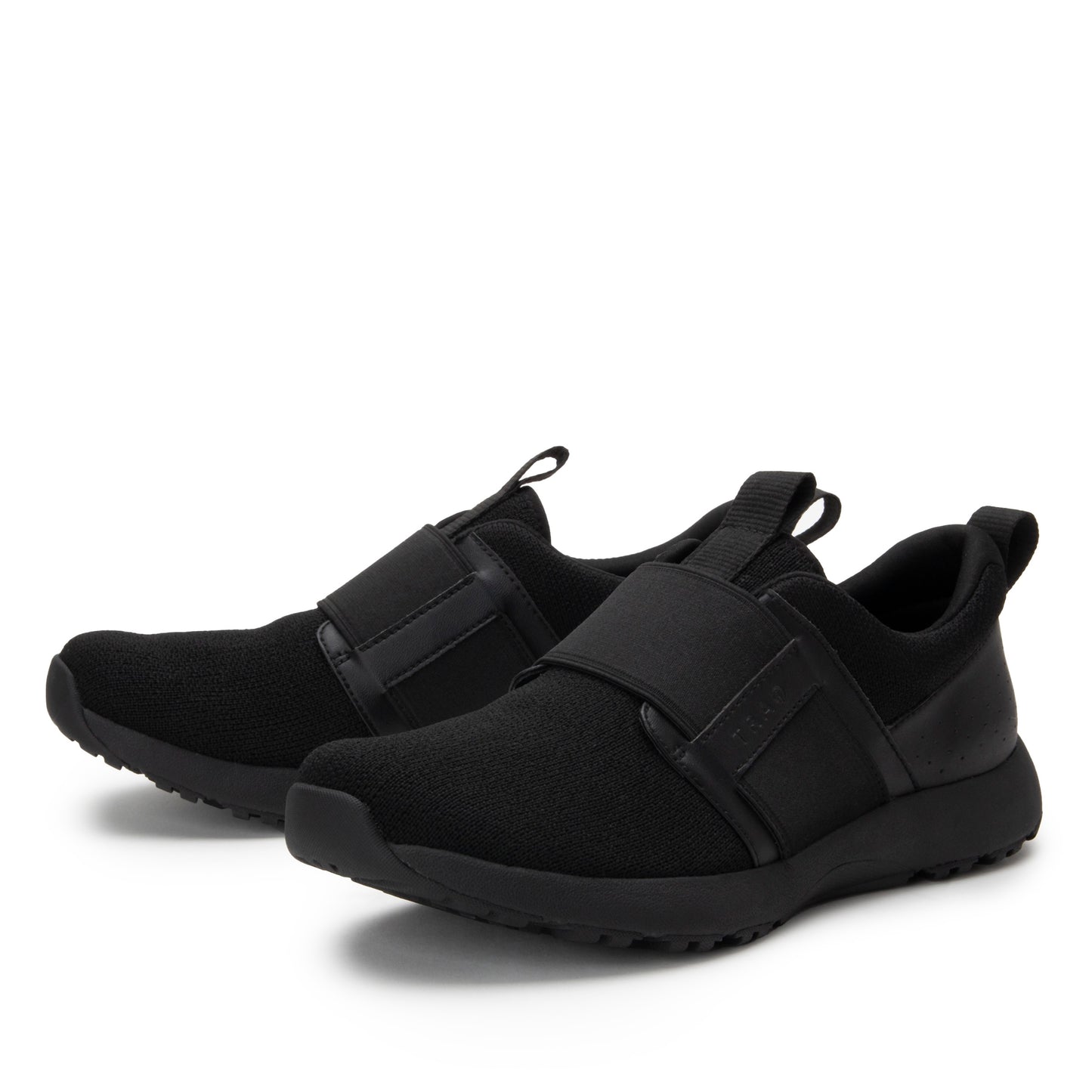 Pair of black slip-on sneakers on a white background