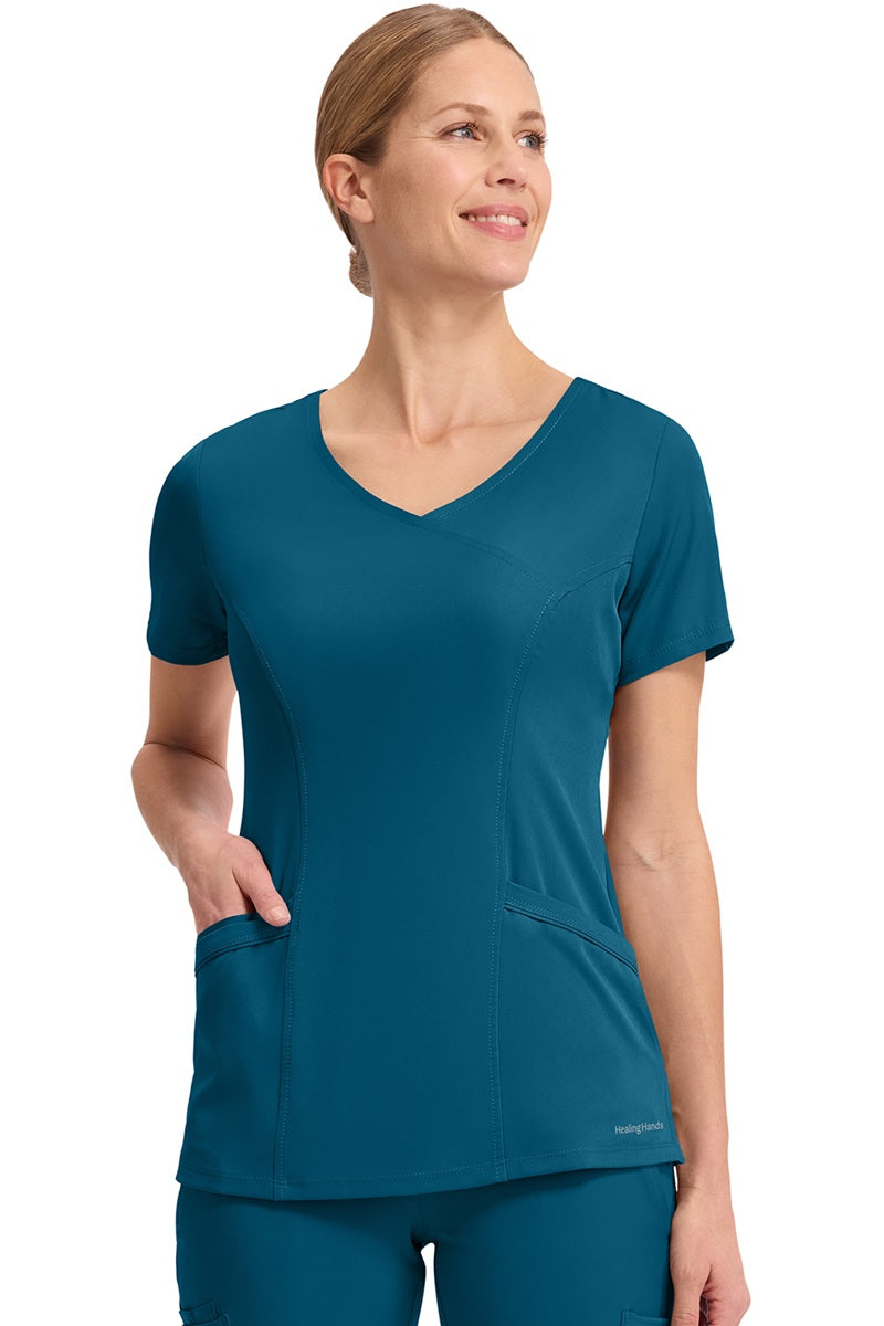 Healing Hands HH Works Madison 2525 scrub top in Caribbean Blue - 4-way stretch women's medical scrub with soil-release finish.
