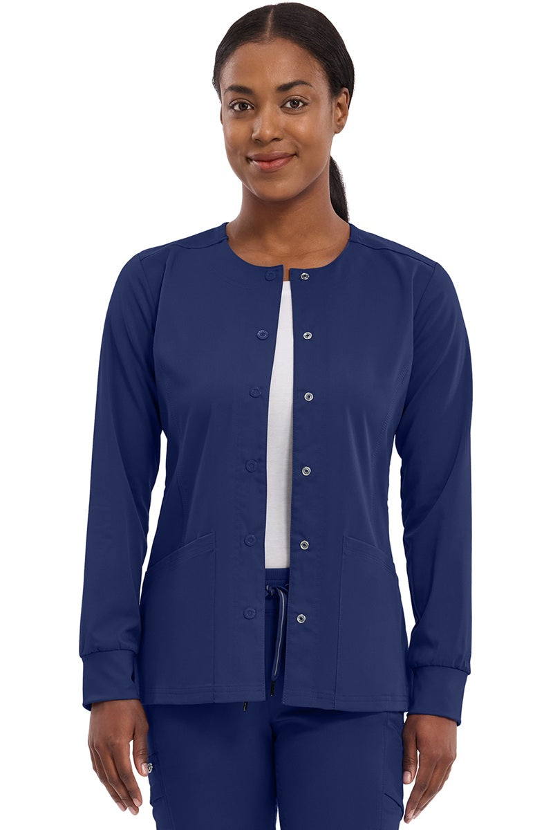 Women's Healing Hands Purple Label Daisy scrub jacket style 5063 in navy blue with snap front closure, zipper pockets, and 2-way stretch moisture-wicking fabric for nurses and healthcare professionals.