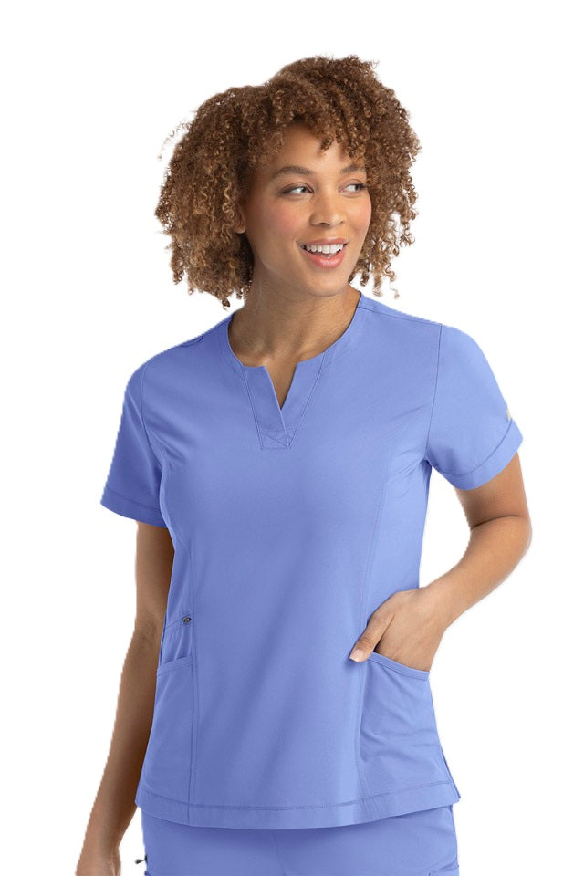 Ceil blue medical scrub top featuring princess seams and functional side vents - IRG EPIC 4802 women's uniform.
