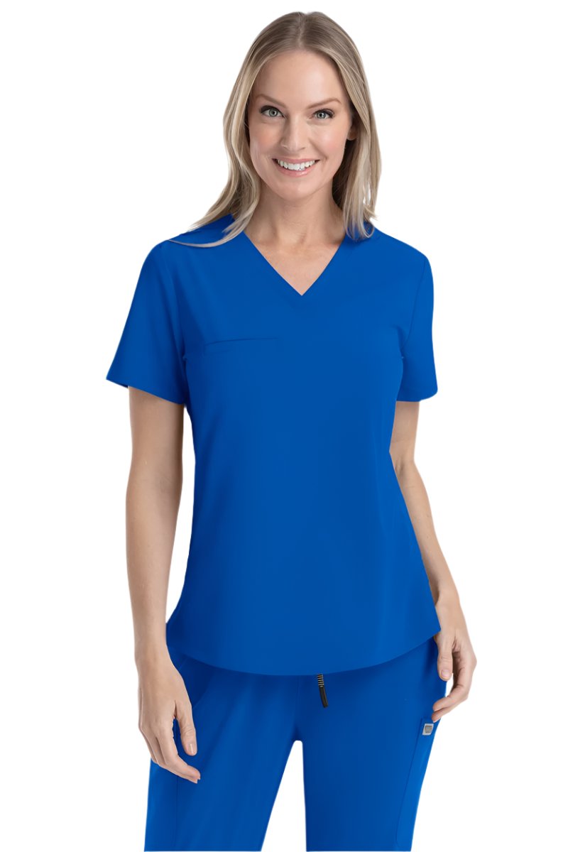 Women's royal blue V-neck scrub top IRG EPIC 4803 with moisture-wicking fabric and curved hem for healthcare professionals.