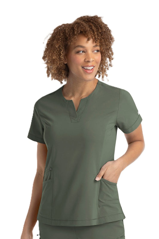 Women's olive green scrub top with notched crew neck, princess seams, and zipper pocket - IRG EPIC 4802 medical uniform.