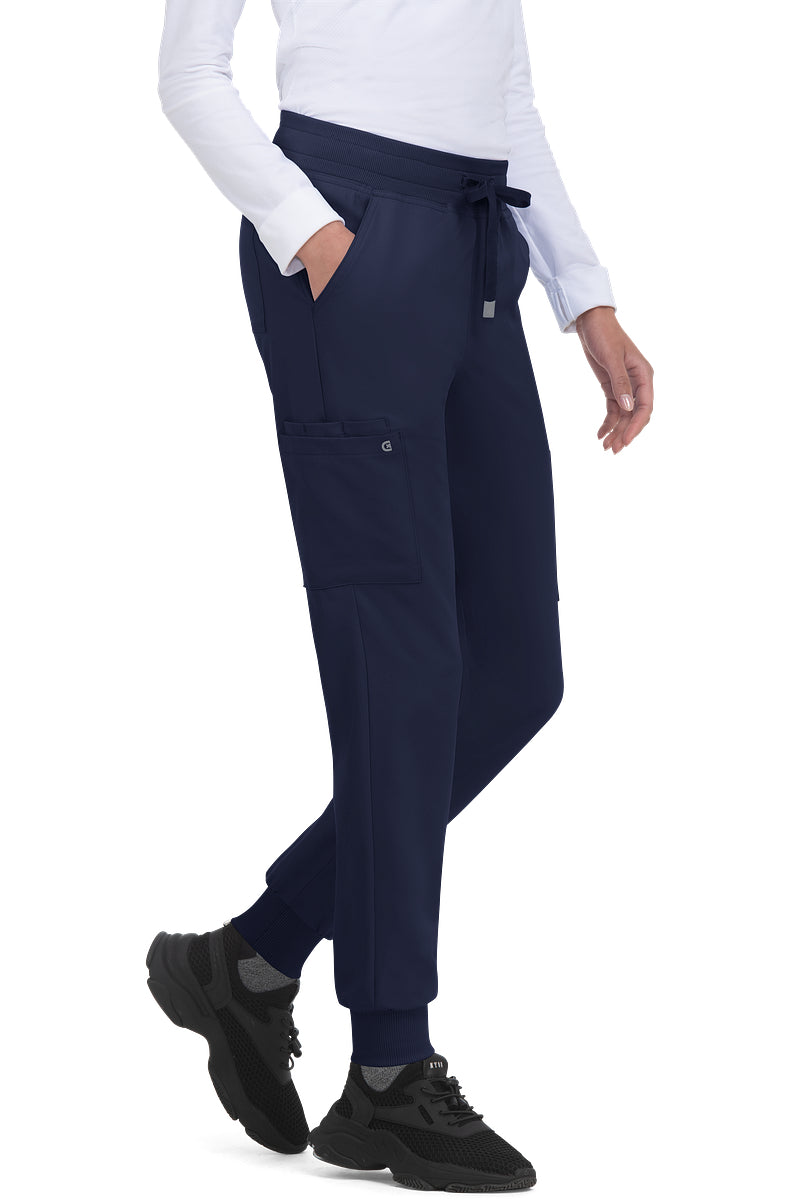 Koi Cureology C700 women's jogger scrub pants in Navy Blue with 6 pockets, drawstring waist, and ribbed ankle cuffs - premium medical scrubs for nurses.