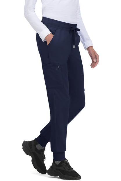 Koi Cureology C700 women's jogger scrub pants in Navy Blue with 6 pockets, drawstring waist, and ribbed ankle cuffs - premium medical scrubs for nurses.