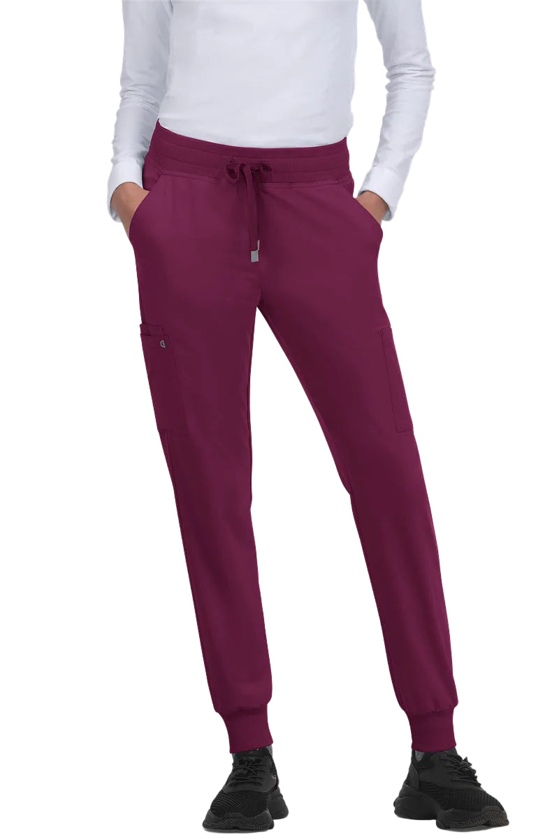 Koi Cureology C700 women's jogger scrub pants in Wine with 6 pockets, drawstring waist, and ribbed ankle cuffs - premium medical scrubs for nurses.