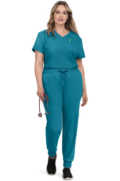 Women's Koi Cureology Aura C100 teal blue tuck in scrub top. Moisture-wicking v-neck medical scrub with functional pockets for nurses and healthcare professionals.