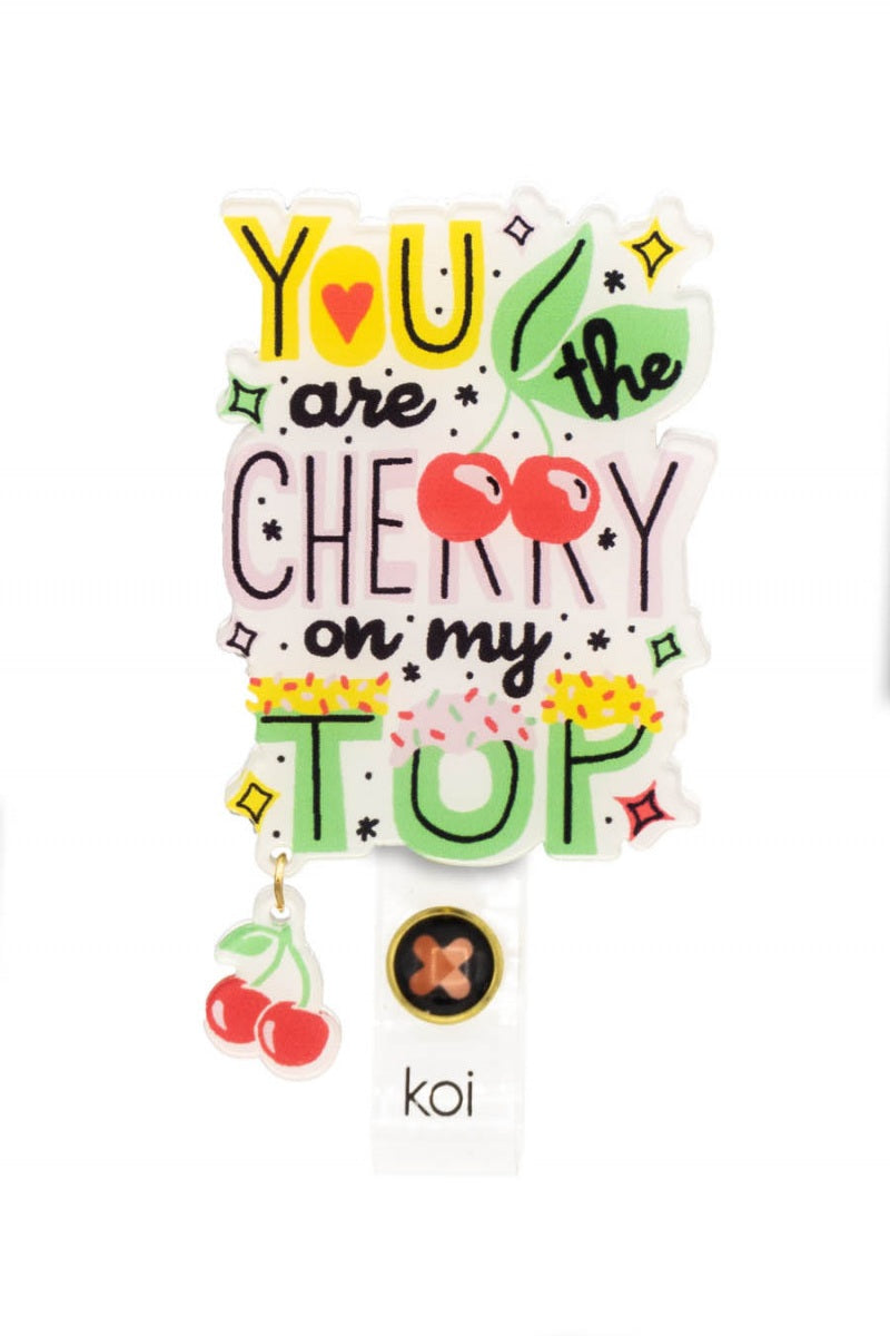 Koi Cherry On Top Badge Reel with retractable cord and snap badge holder at Parker's Clothing & Scrubs.