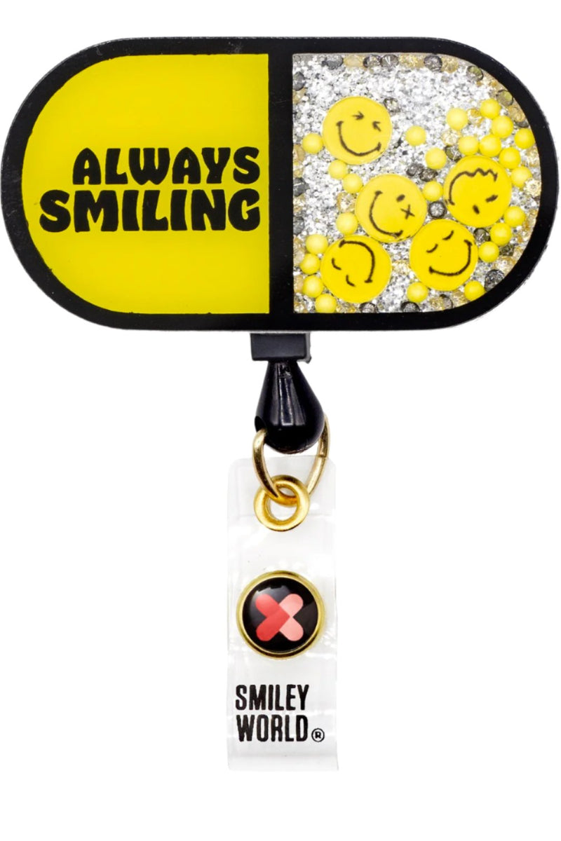 koi SmileyWorld Shaker Badge Reel in Always Smiling Pill design with retractable cord and clip for healthcare professionals.
