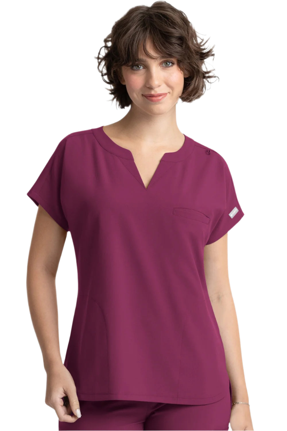 Maevn Momentum 5003 dolman scrub top in wine with 3 pockets, notched neckline, and relaxed fit for healthcare professionals.
