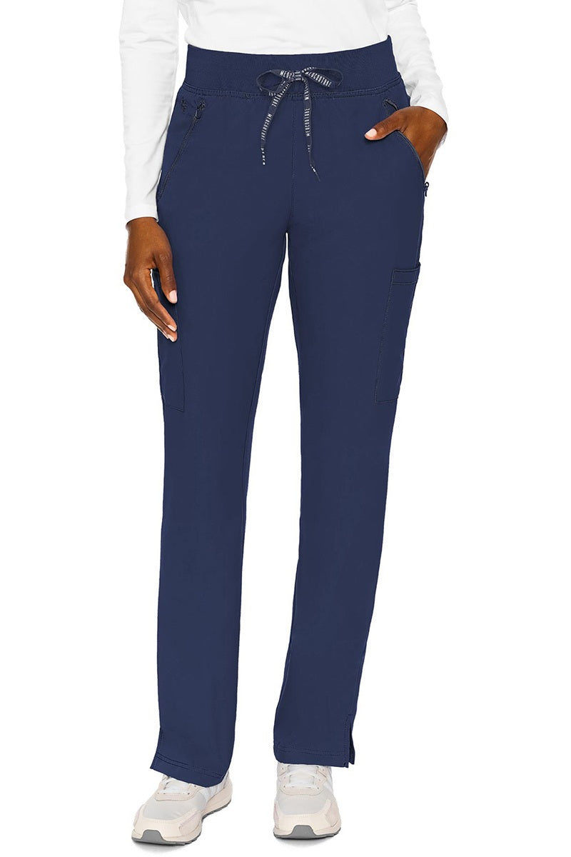 Healthcare professional wearing Med Couture Insight 2702 scrub pants in navy blue with zipper pockets and ultra-soft jersey knit waistband
