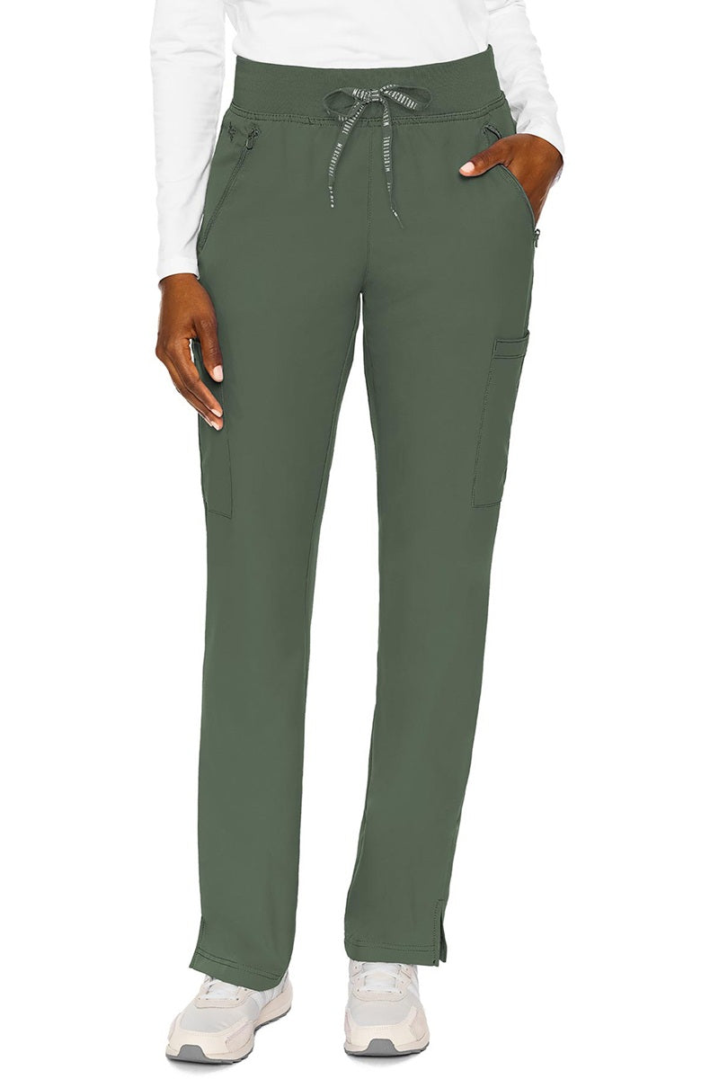 Healthcare worker in Med Couture Insight 2702 scrub pants olive green with mechanical stretch fabric for active environments
