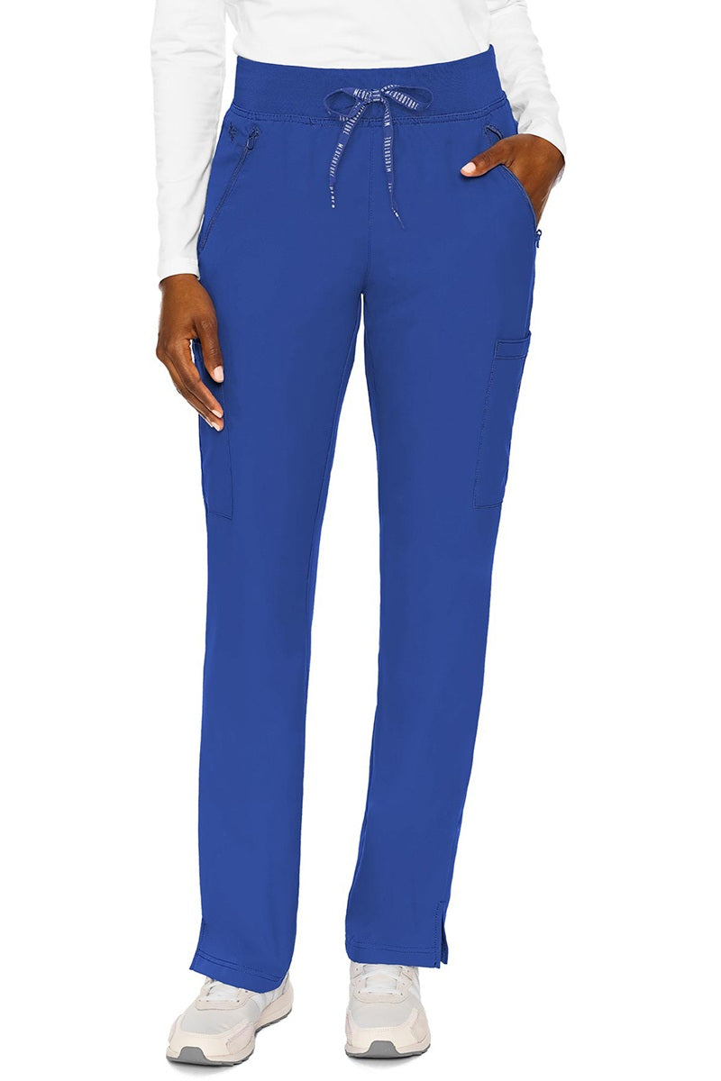 Medical professional wearing Med Couture Insight 2702 scrub pants in royal blue with 4-pocket storage and tailored silhouette
