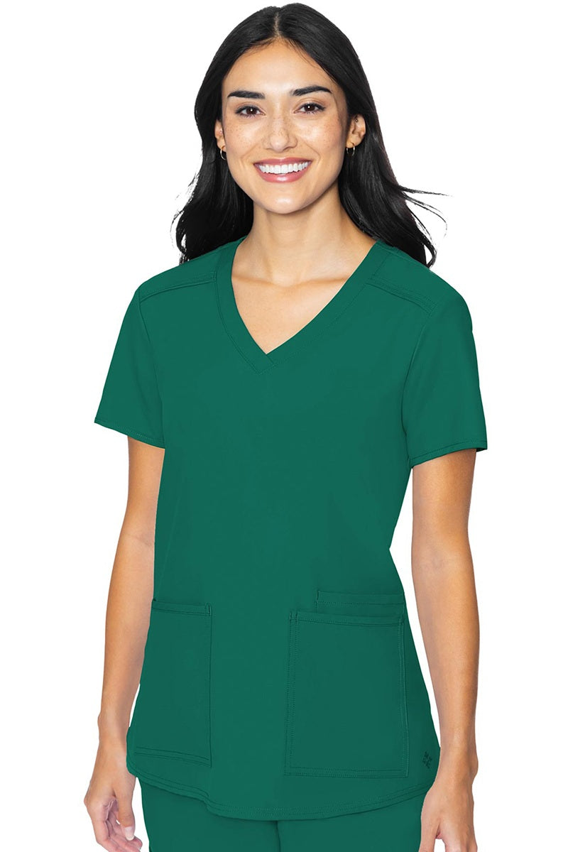 Med Couture Insight 2411 women's scrub top in hunter green featuring classic v-neck, 3 functional pockets, and box pleat design for healthcare professionals
