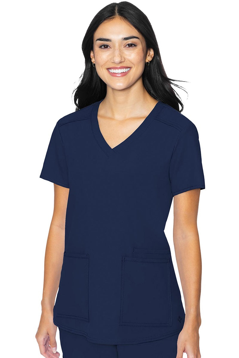 Med Couture Insight 2411 women's scrub top in navy blue featuring classic v-neck, 3 functional pockets, and box pleat design for healthcare professionals
