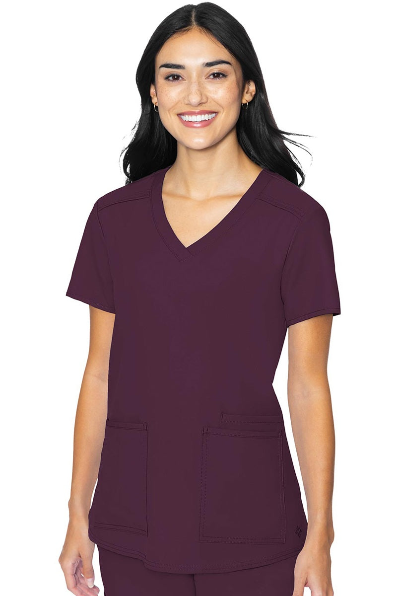 Med Couture Insight 2411 women's scrub top in wine featuring classic v-neck, 3 functional pockets, and box pleat design for healthcare professionals
