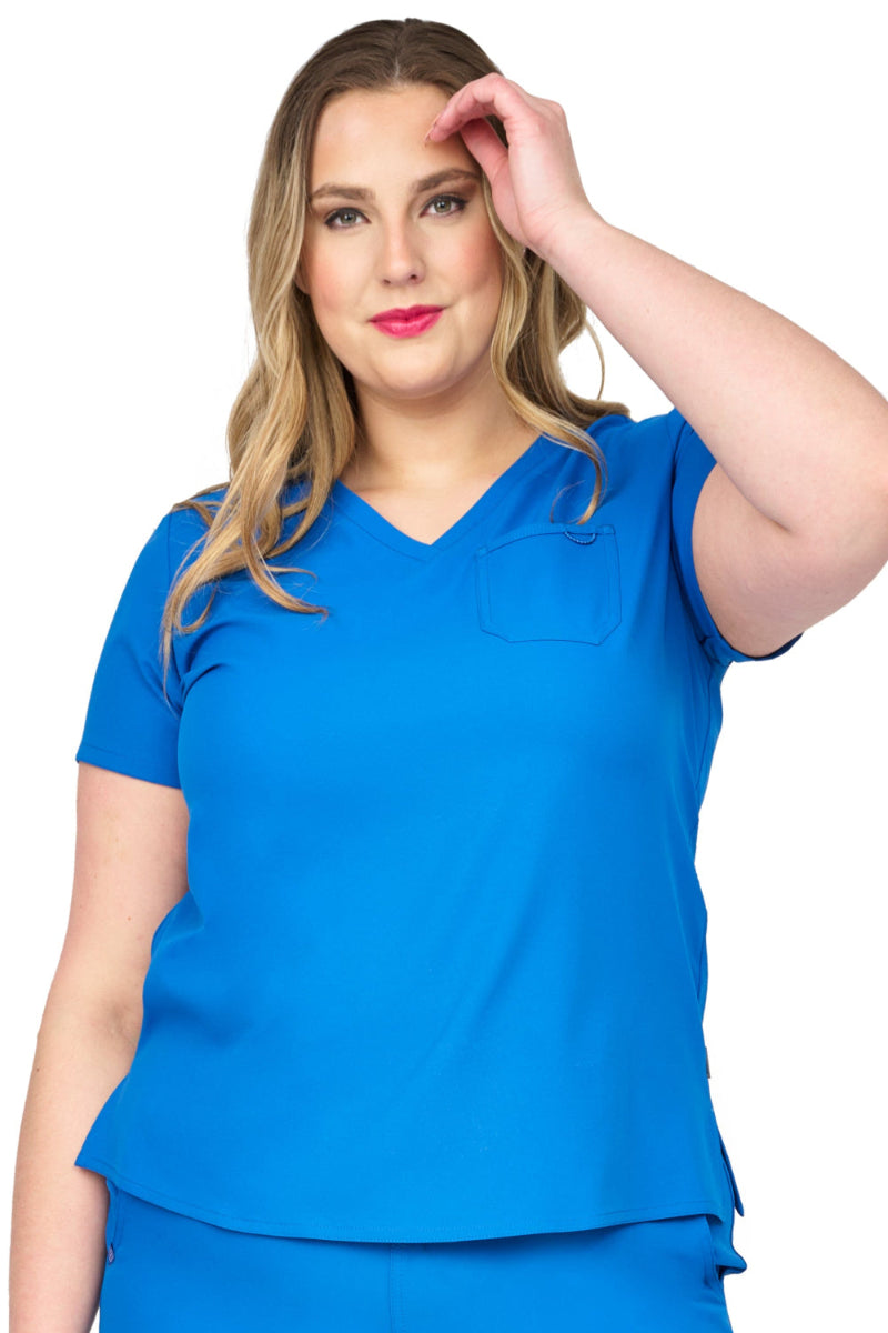 Zavate Studio Elevate scrub top in royal blue with premium comfort design, durable chest pocket, and sleek silhouette for doctors, nurses, and healthcare workers.