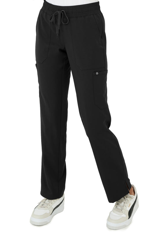 Healthcare professional wearing Zavate Studio Energy straight leg scrub pants in black with elastic waistband and multiple pockets.