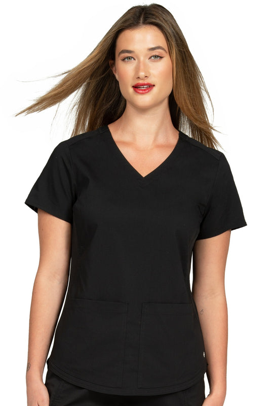 Zavate Zoe Alexandra Soho Side Knit scrub top 1148 in black - front view showing two patch pockets, shoulder yokes, and curved hemline on healthcare professional.