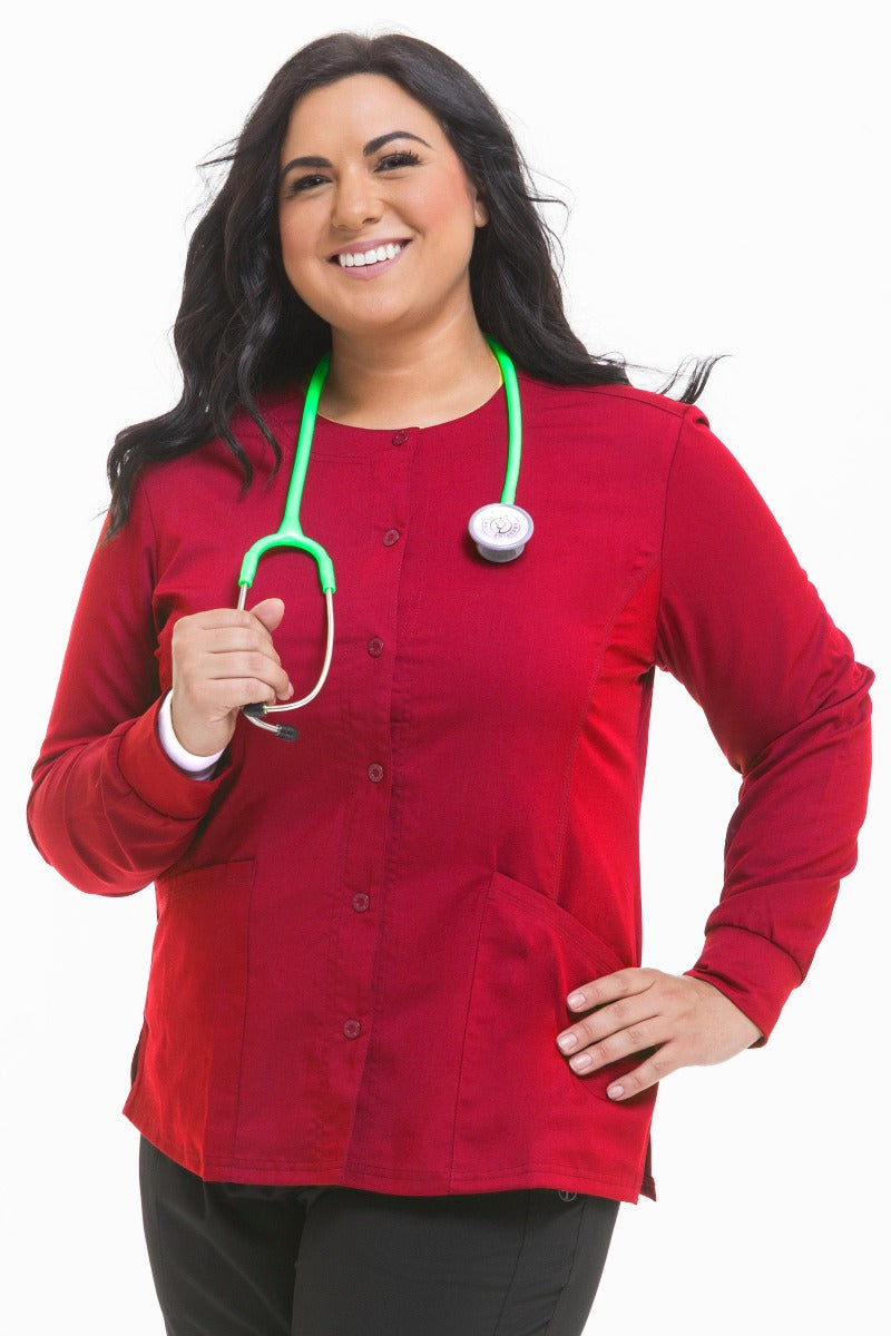Women's Healing Hands Purple Label Daisy scrub jacket style 5063 in red with snap front closure, zipper pockets, and 2-way stretch moisture-wicking fabric for nurses and healthcare professionals.
