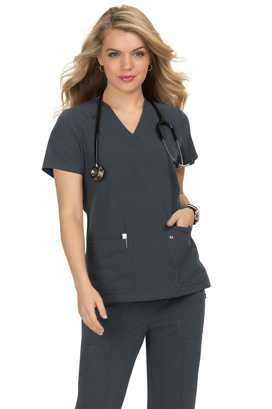 Koi Next Gen Hustle and Heart scrub top 1019 in Charcoal Grey - professional nursing scrub with signature back tab detail and functional pockets.
