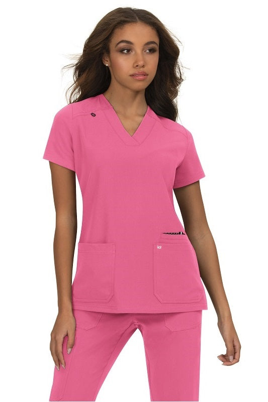 Koi Next Gen Hustle and Heart scrub top 1019 in Rose Pink - durable medical scrub with 4-way stretch for nurses and veterinary technicians.
