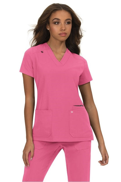 Koi Next Gen Hustle and Heart scrub top 1019 in Rose Pink - durable medical scrub with 4-way stretch for nurses and veterinary technicians.
