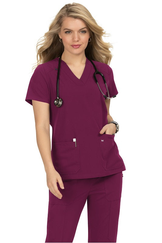 Koi Next Gen Hustle and Heart scrub top 1019 in Wine - professional scrub top with side slits and enhanced mobility for long shifts.
