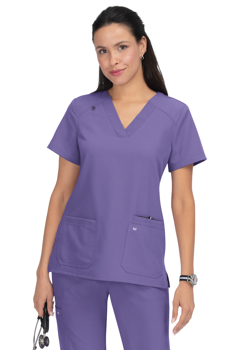 Koi Next Gen Hustle and Heart scrub top 1019 in Wisteria - premium healthcare apparel with wide V-neck and signature Koi styling.
