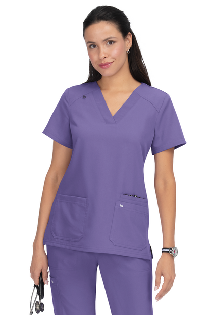 Koi Next Gen Hustle and Heart scrub top 1019 in Wisteria - premium healthcare apparel with wide V-neck and signature Koi styling.
