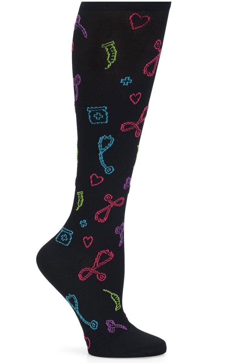 Nurse Mates wide calf compression socks in black with medical symbols pattern including stethoscopes and hearts, 12-14 mmHg graduated compression, fits calves up to 22 inches, healthcare professional support hosiery.